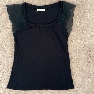 Small black short sleeve shirt with ruffle details on the sleeves